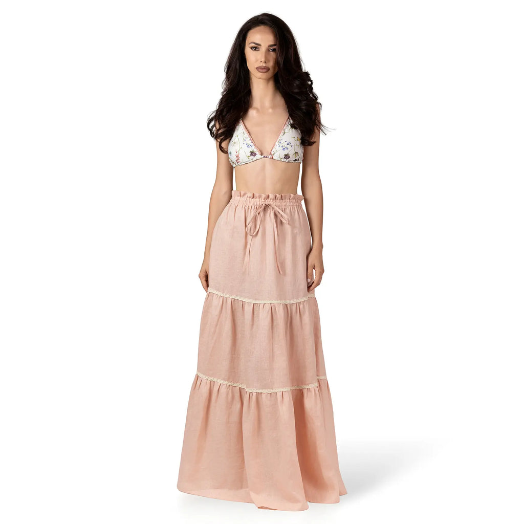 ALURE PEACH Linen Long Skirt by BILEYA COUTURE crafted from 100% natural linen, featuring a flowing three-tiered silhouette, crochet lace details, elasticated waistband, and elegant maxi length for luxury designer resort wear styling.
