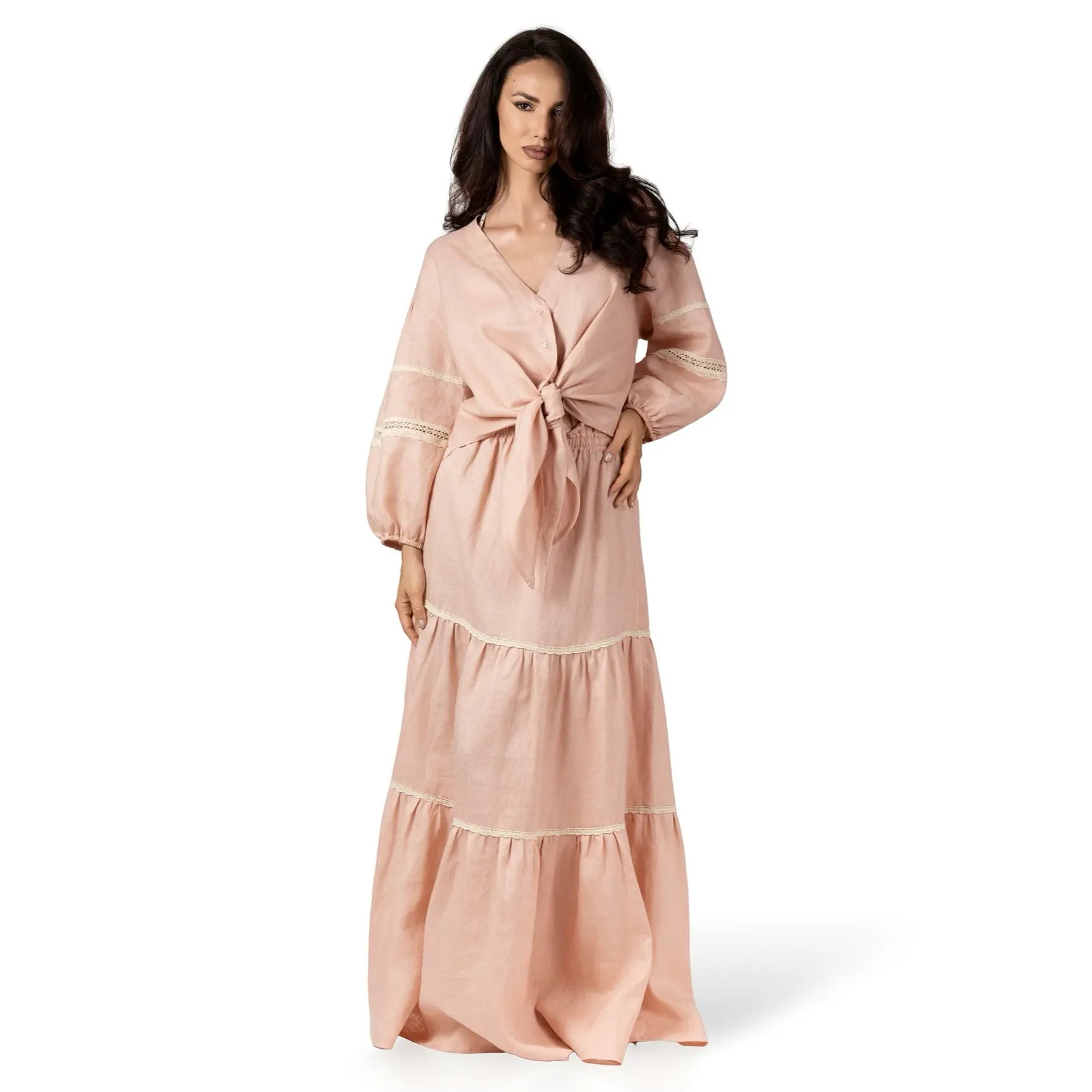 ALURE PEACH Linen Long Skirt by BILEYA COUTURE crafted from 100% natural linen, featuring a flowing three-tiered silhouette, crochet lace details, elasticated waistband, and elegant maxi length for luxury designer resort wear styling.
