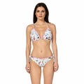 Woman wearing a floral bikini set by bileya couture