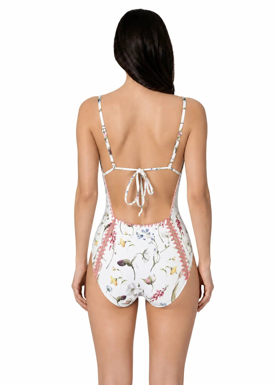 Woman wearing a floral one-piece swimsuit by bileya couture