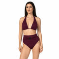 Woman wearing a burgundy bikini set on a white background