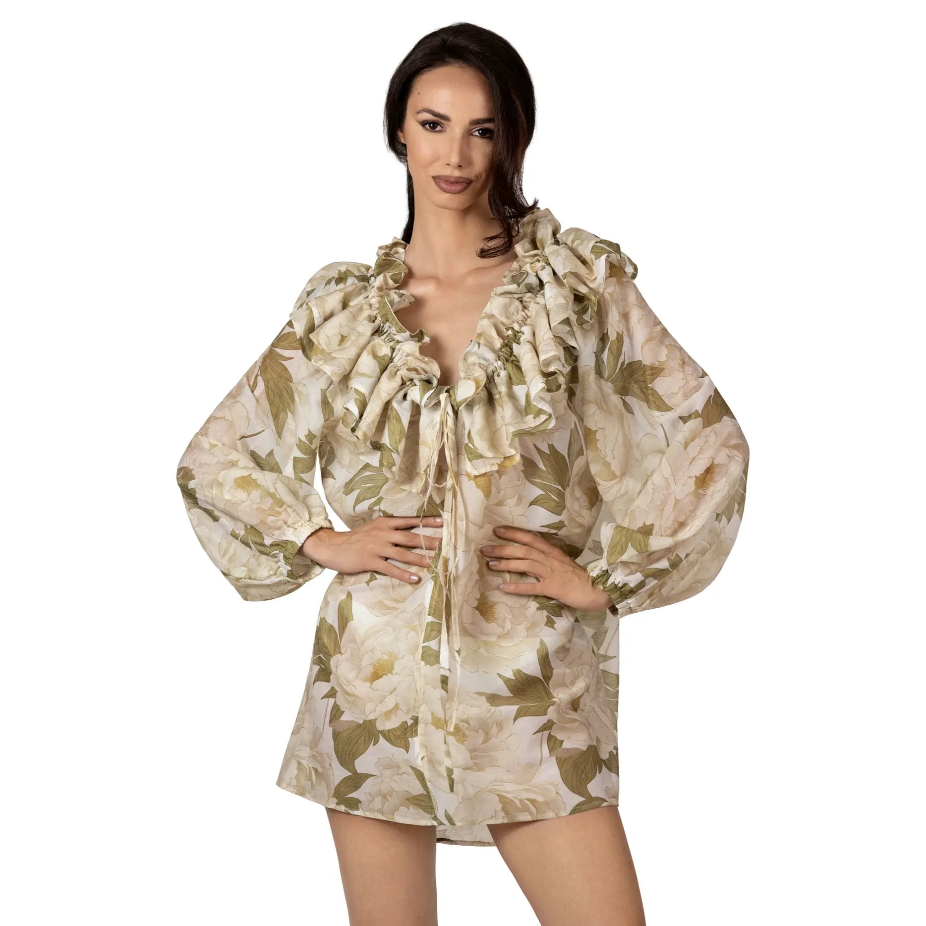 FLEUR DE LUMIÈRE Long Sleeve Top by BILEYA COUTURE crafted from luxurious silk-cotton chiffon, featuring a romantic white floral print, elegant ruffle neckline, adjustable front ties, long sleeves with elastic cuffs, and an airy designer resort wear silhouette.
