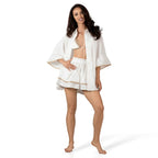 AMELIE WHITE boutique set by BILEYA COUTURE – luxury white cotton shirt worn open with elegant ruffle skort