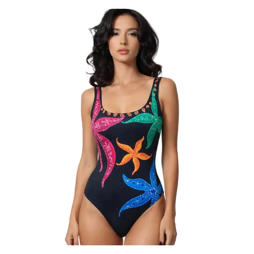 Woman wearing a colorful swimsuit with floral patterns on a white background