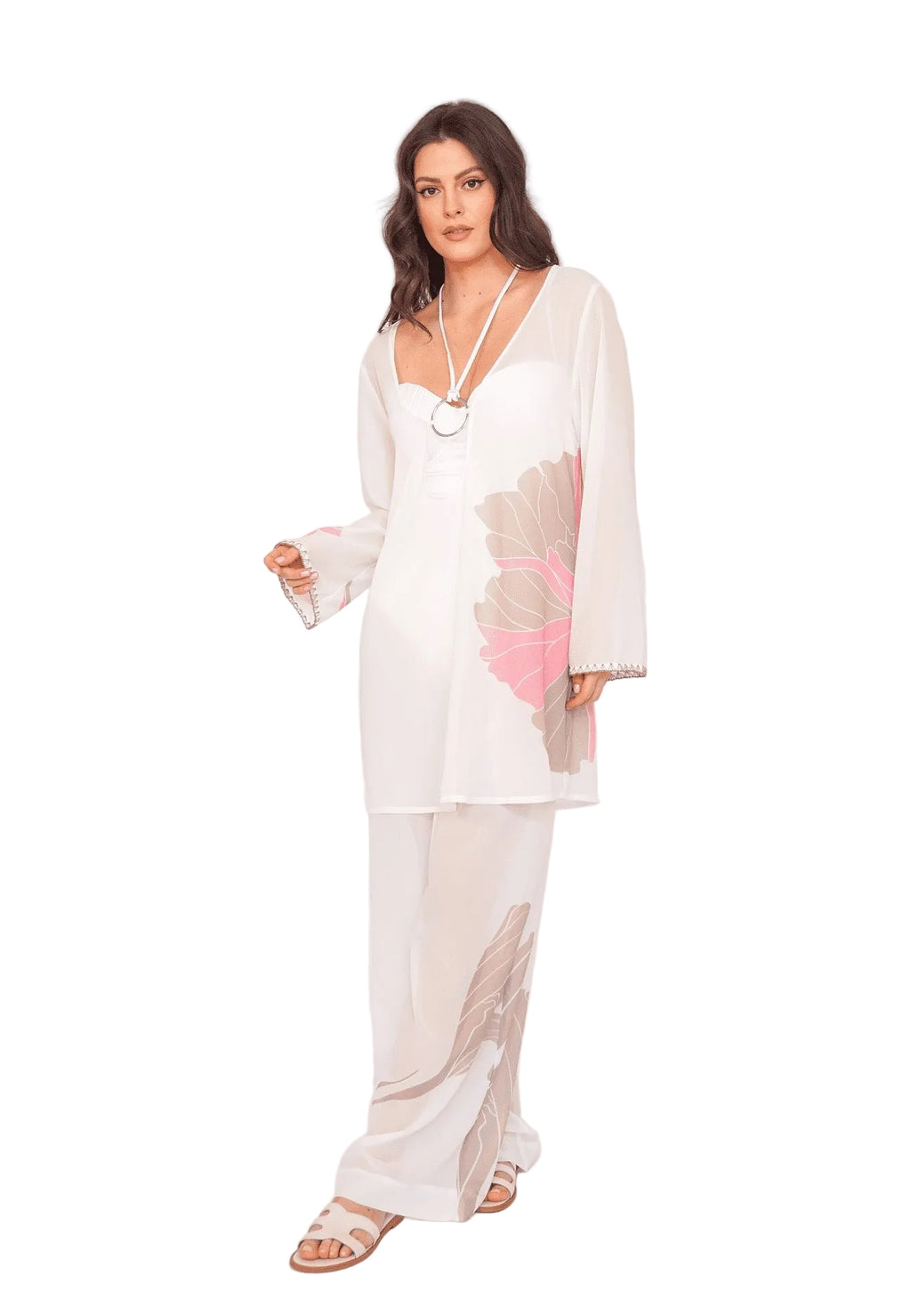 Woman wearing a white outfit with floral patterns on a white background