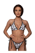 Woman wearing a leopard print bikini by Bileya Couture on a white background
